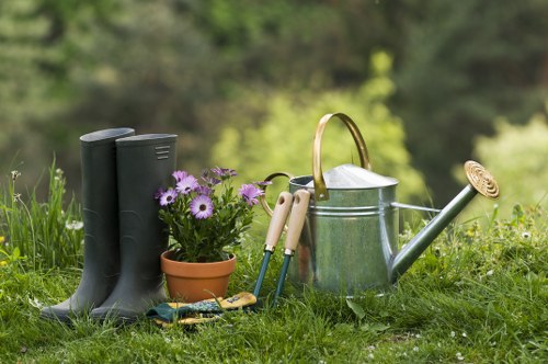 Landscaper preparing soil and planting in an urban garden